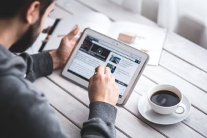 man holding ipad